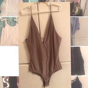 One-piece shiny body suit